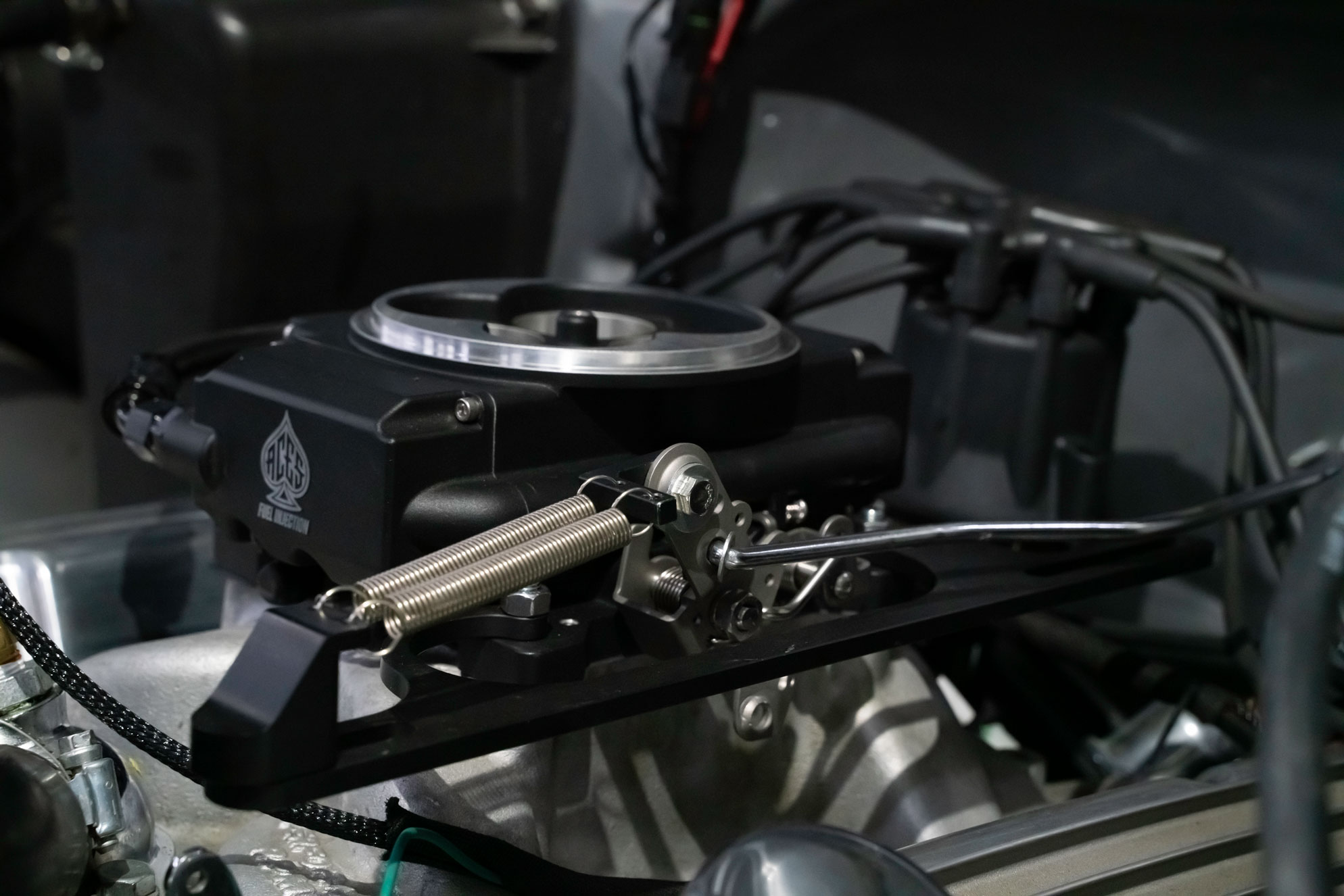 Placeholder for a throttle linkage, oxygen sensor or engine-bay detail photo